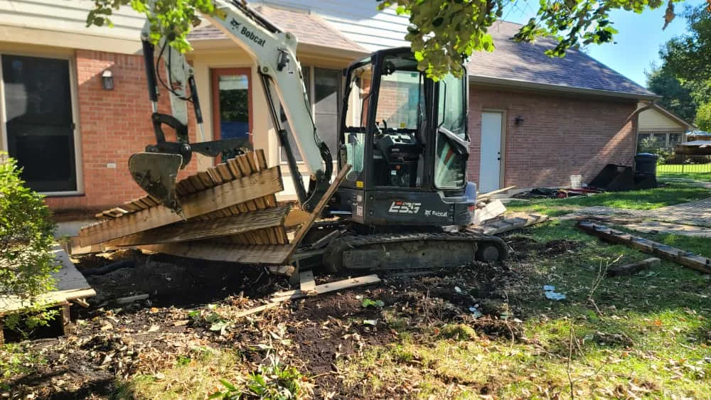 Completed deck removal showing clean yard ready for new construction